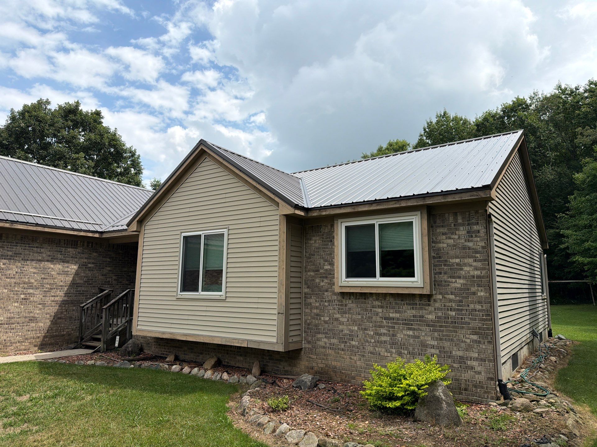 Exposed fastener metal roof installed by Michigan Metal Roofing
