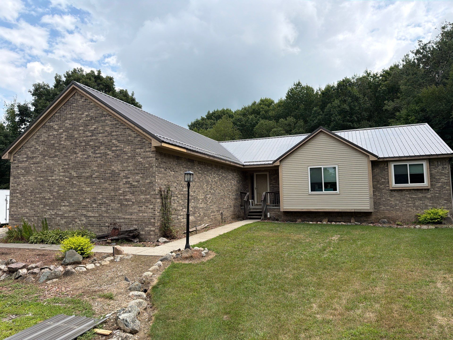 Exposed fastener metal roof installed by Michigan Metal Roofing
