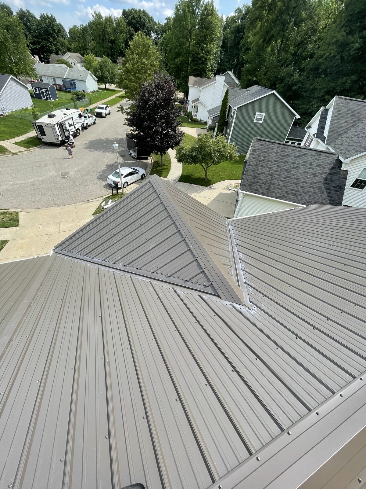 Exposed fastener metal roof installed by Michigan Metal Roofing