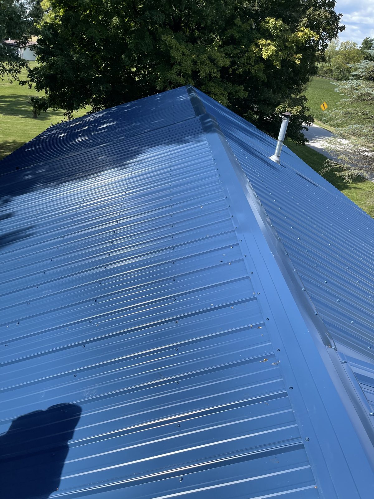 Exposed fastener metal roof installed by Michigan Metal Roofing