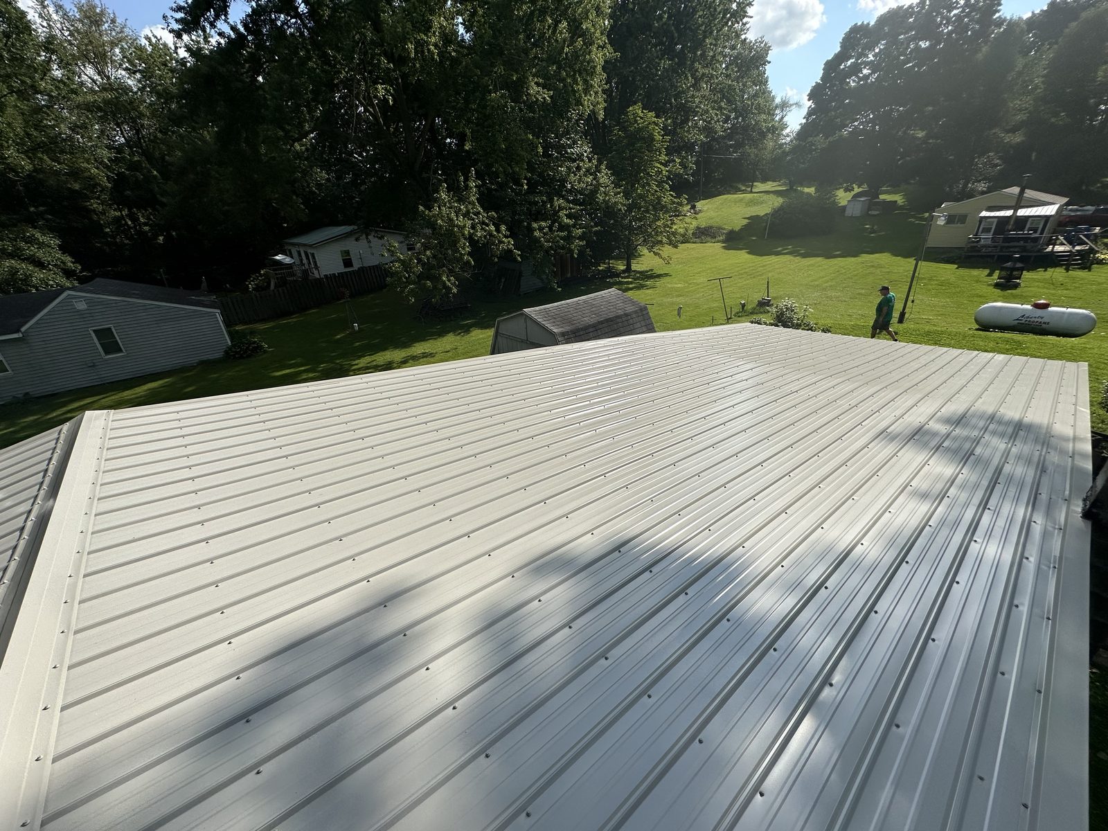 Exposed fastener metal roof installed by Michigan Metal Roofing