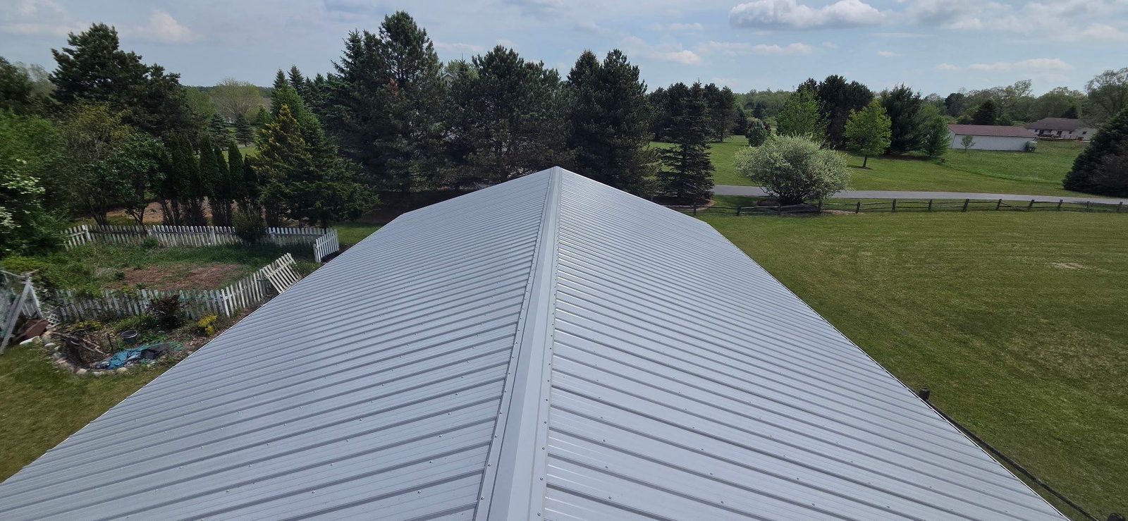 Exposed fastener metal roof installed by Michigan Metal Roofing