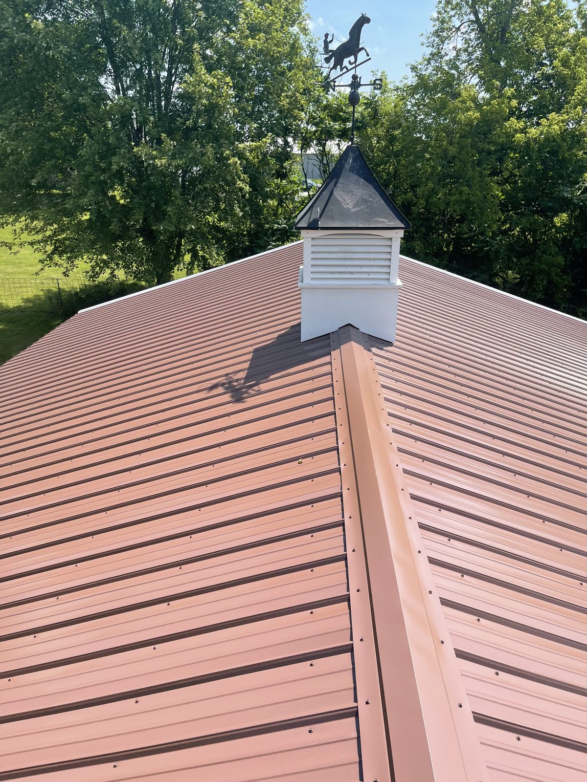 Exposed fastener metal roof installed by Michigan Metal Roofing