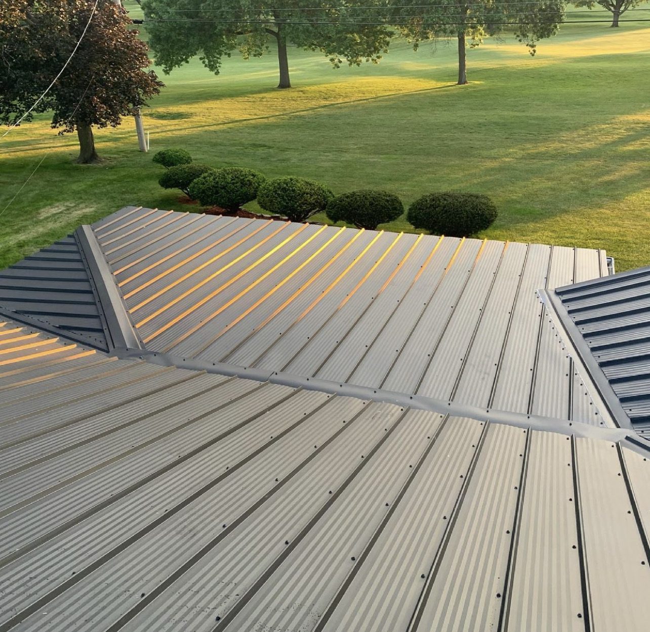 Exposed fastener metal roof installed by Michigan Metal Roofing