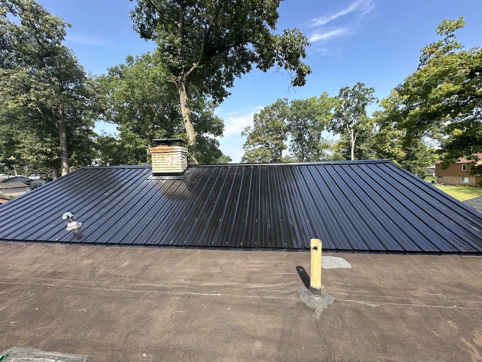 Exposed fastener metal roof installed by Michigan Metal Roofing