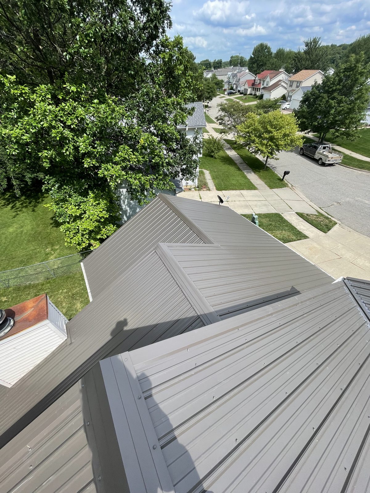 Exposed fastener metal roof installed by Michigan Metal Roofing