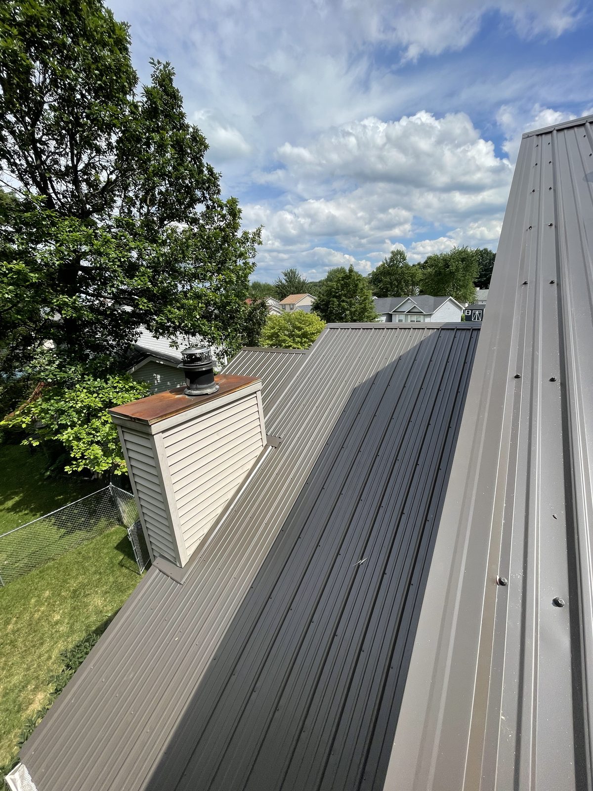 Exposed fastener metal roof installed by Michigan Metal Roofing