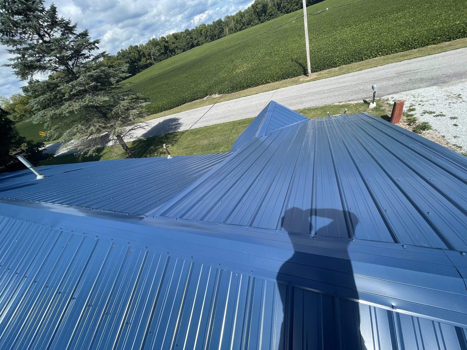 Exposed fastener metal roof installed by Michigan Metal Roofing