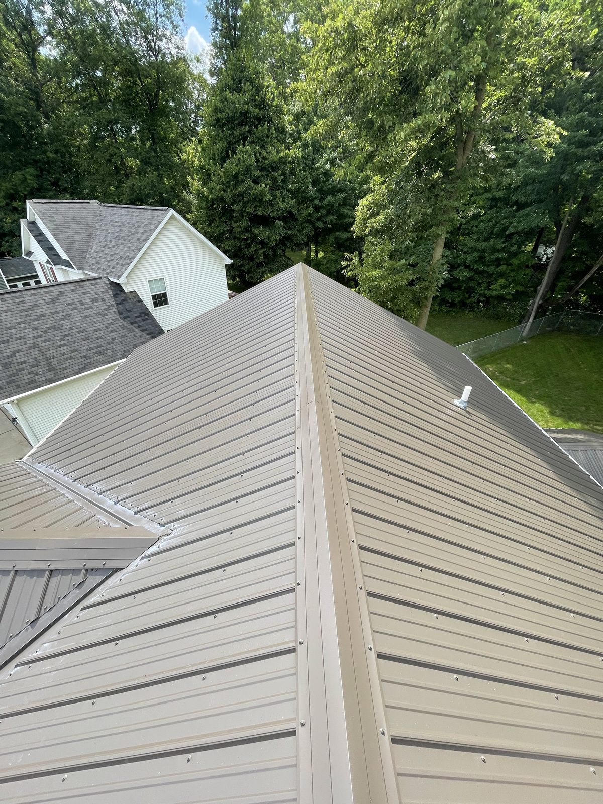 Exposed fastener metal roof installed by Michigan Metal Roofing