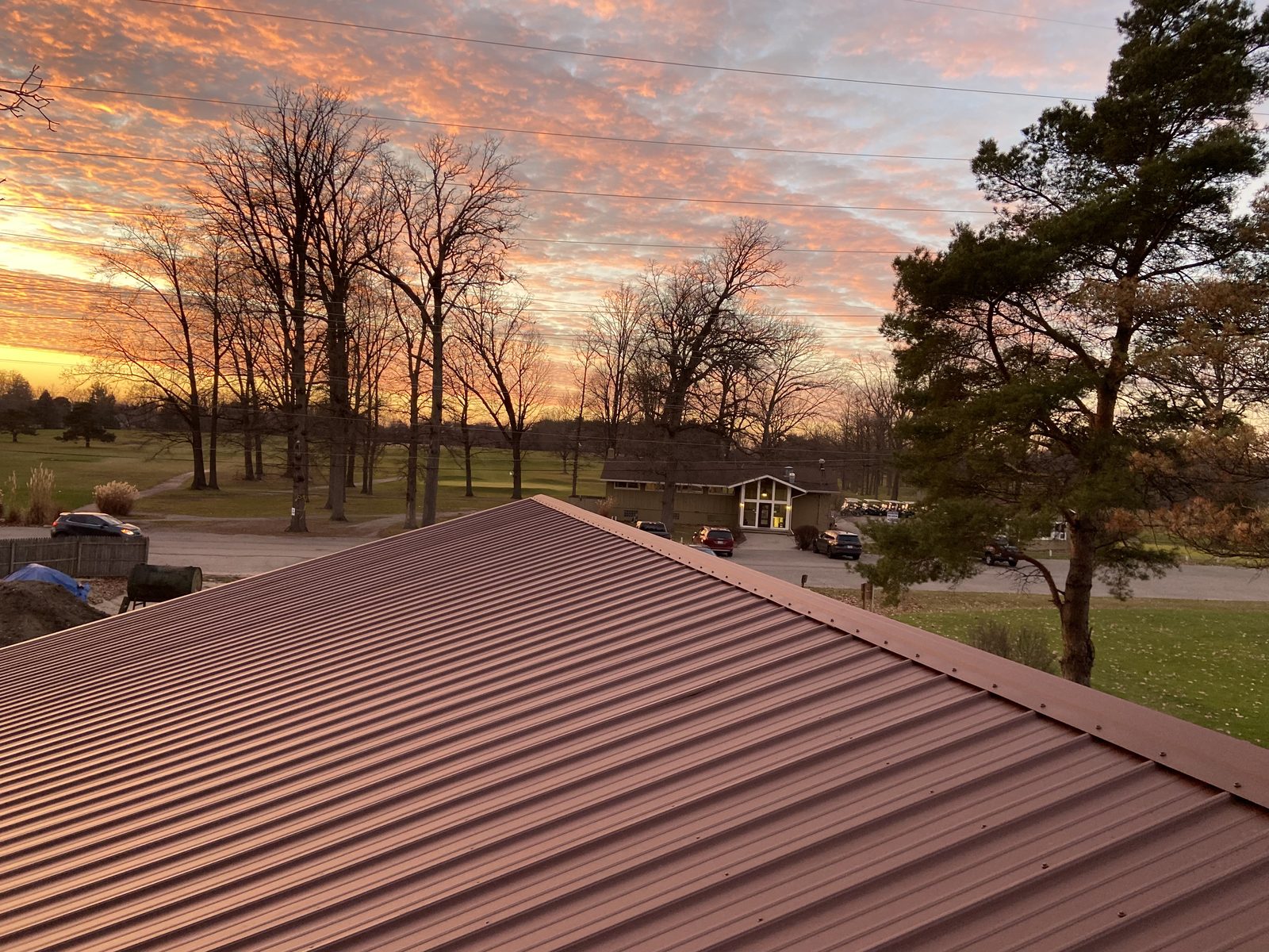 Exposed fastener metal roof installed by Michigan Metal Roofing