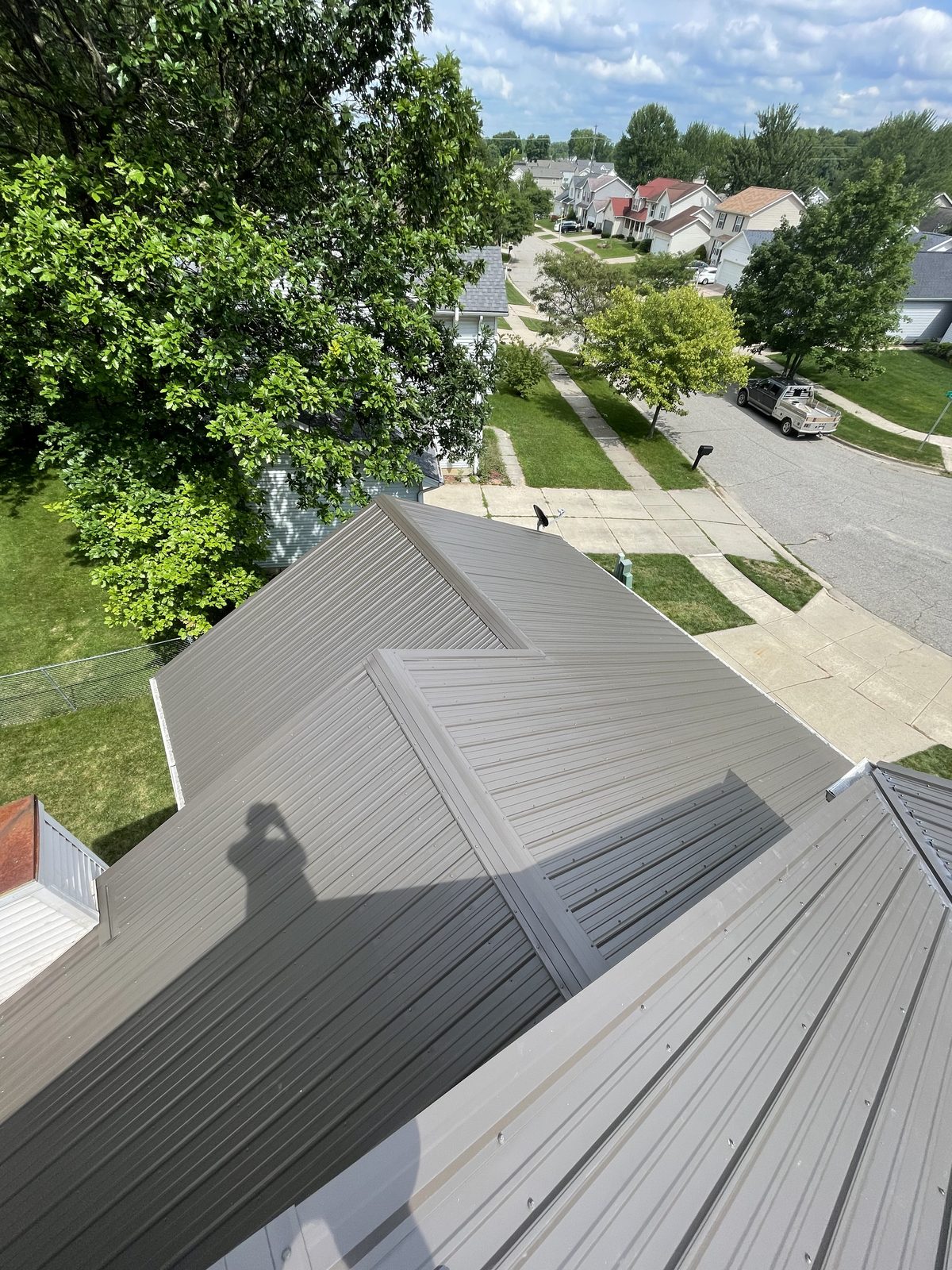 Exposed fastener metal roof installed by Michigan Metal Roofing