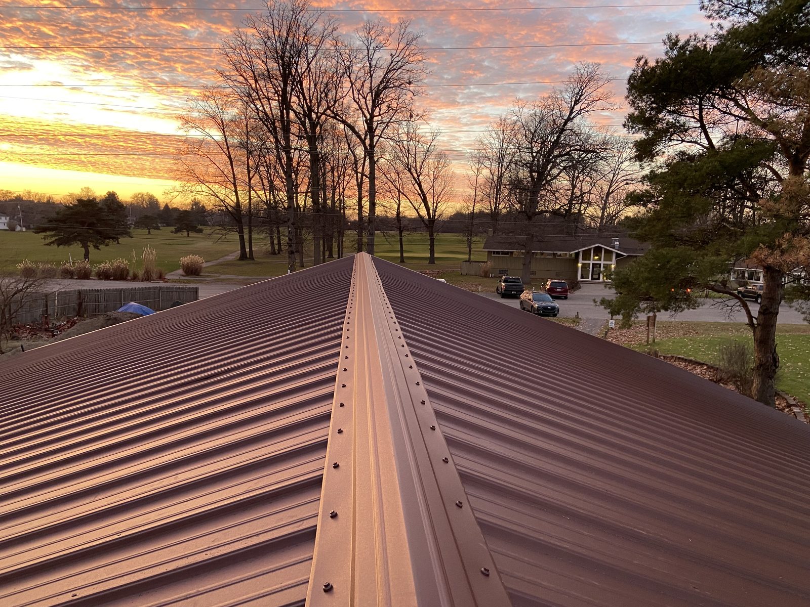 Exposed fastener metal roof installed by Michigan Metal Roofing
